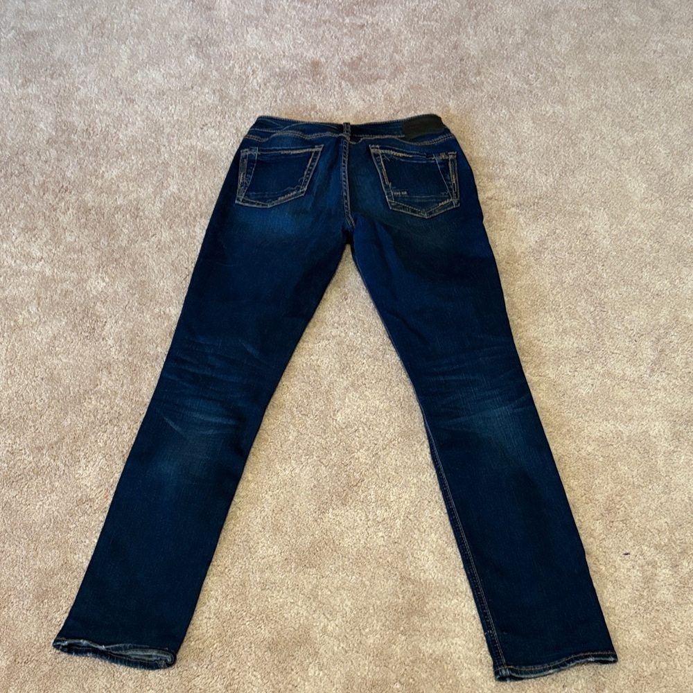Dark wash Silver Jeans.